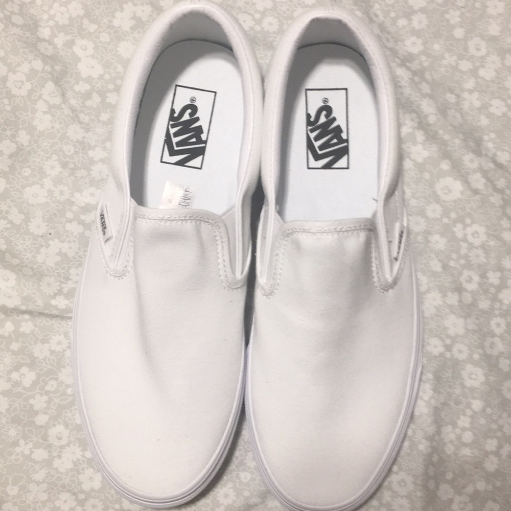 All white slip on vans